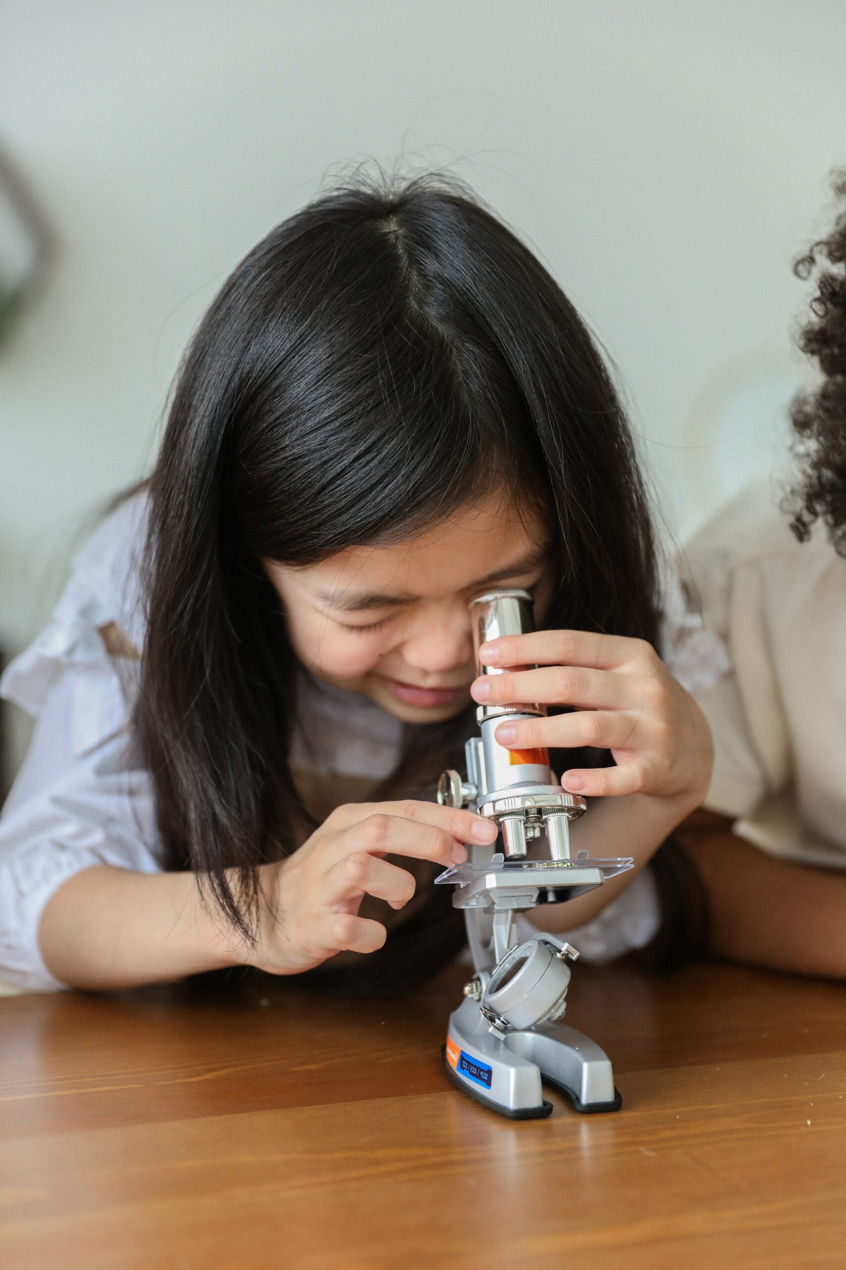 Child peers into microscope